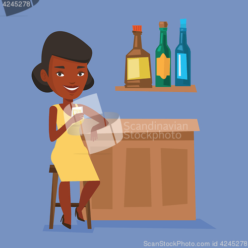 Image of Woman sitting at the bar counter.