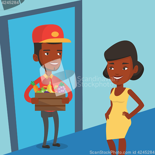 Image of Delivery courier delivering groceries to customer.