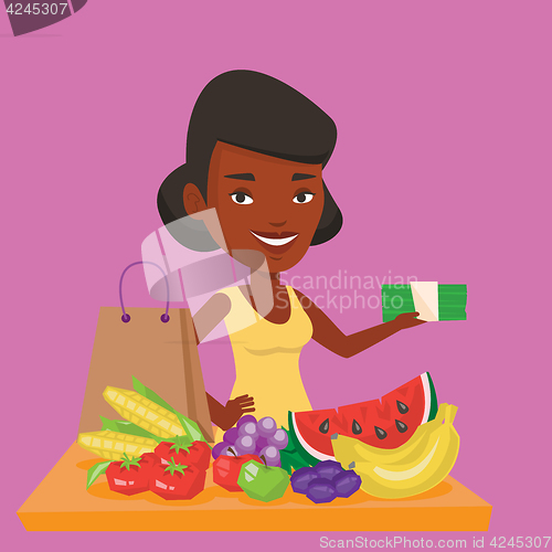 Image of Woman standing at the table with shopping bag.