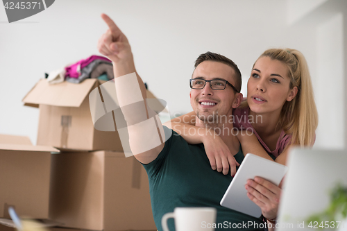 Image of Young couple moving in a new home