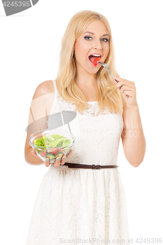 Image of Woman eating fresh salad