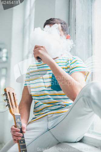 Image of The face of vaping young man
