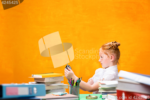 Image of Teen girl with lot of books