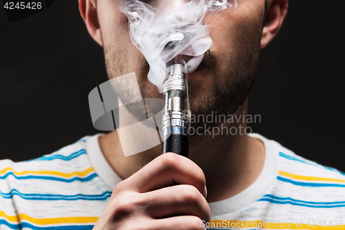 Image of The face of vaping young man