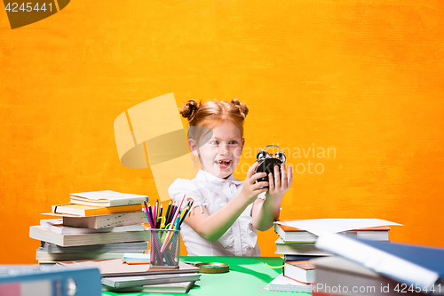 Image of Teen girl with lot of books