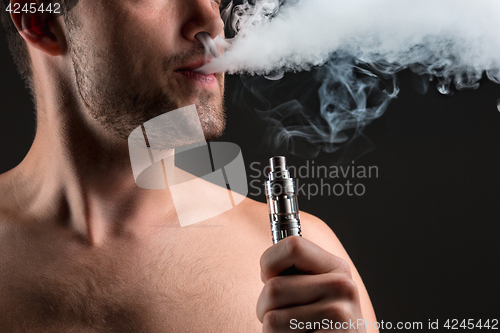 Image of The face of vaping young man