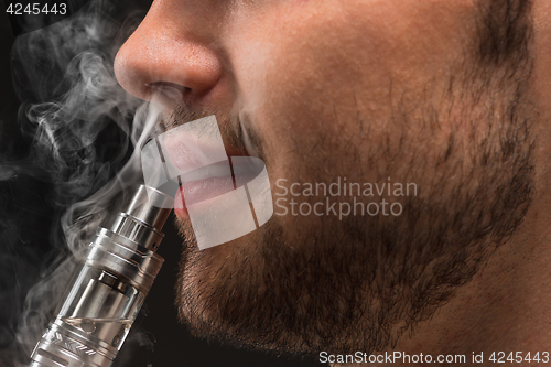 Image of The face of vaping young man