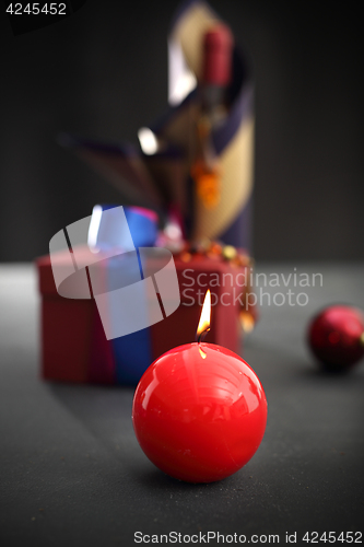 Image of Red candle, festive atmosphere in the house