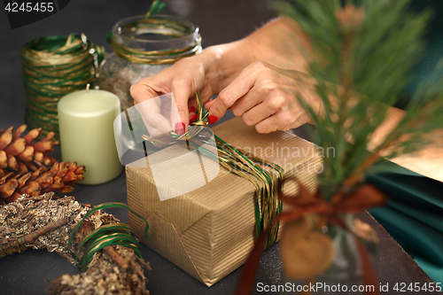 Image of Florists, art decoration. Christmas gift idea how to decorate a gift.