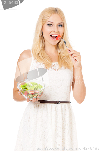 Image of Woman eating fresh salad