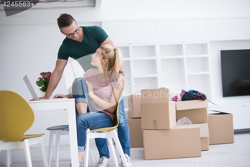 Image of Young couple moving in a new home