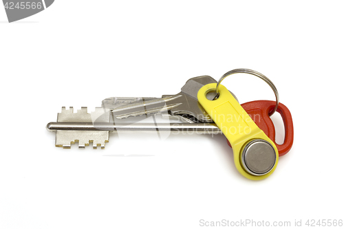Image of Keys to the apartment on white background. The concept of the popularity new housing