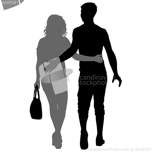 Image of Silhouette man and woman walking hand in hand