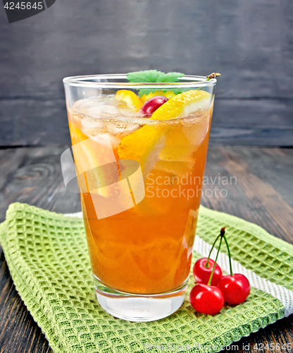 Image of Lemonade cherry and orange in glassful on board