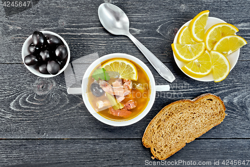 Image of Solyanka in bowl on black board top