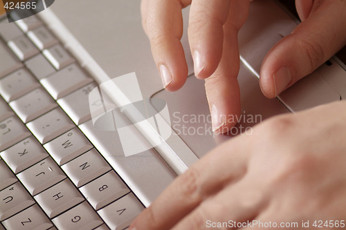 Image of hands on notebook