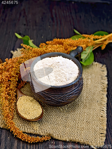 Image of Flour amaranth in clay cup with flower on board