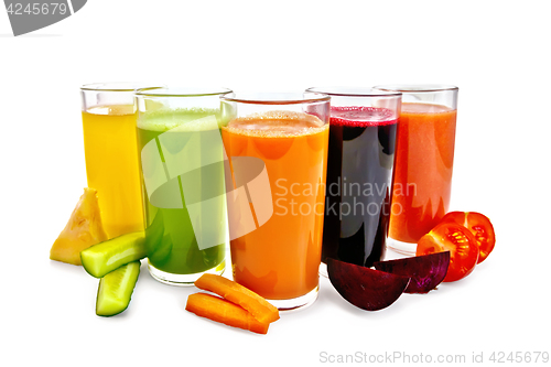 Image of Juice vegetable in five tall glasses with vegetables