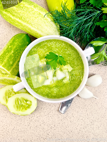 Image of Soup cucumber in white bowl on granite table top