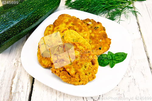 Image of Flapjack chickpeas with zucchini in plate on board