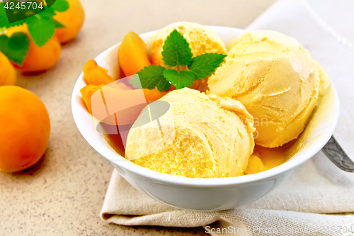 Image of Ice cream apricot in bowl on napkin