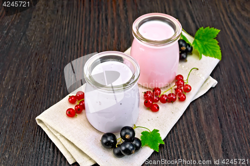 Image of Milk cocktail with black and red currant on board