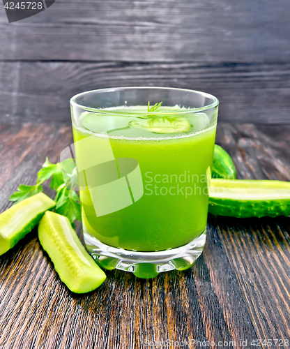 Image of Juice cucumber in glassful on dark board