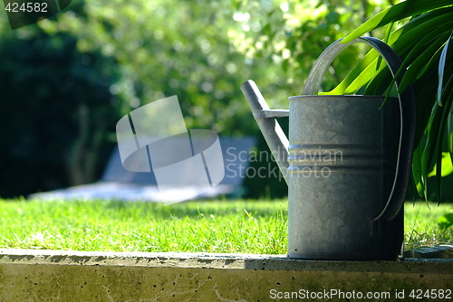 Image of watering can of metal