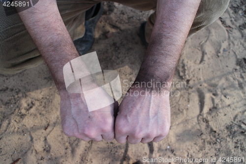 Image of  working hands of chimney-sweeper