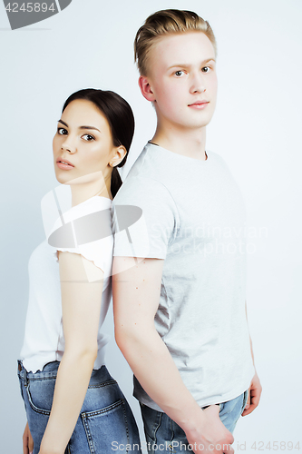 Image of young pretty teenage couple, hipster guy with his girlfriend happy smiling and hugging isolated on white background, lifestyle people concept 