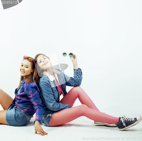 Image of best friends teenage girls together having fun, posing emotional on white background, besties happy smiling, lifestyle people concept close up