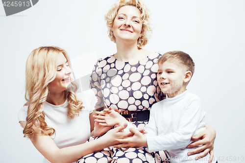 Image of happy smiling family together posing cheerful on white background, lifestyle people concept, mother with son and teenage daughter isolated