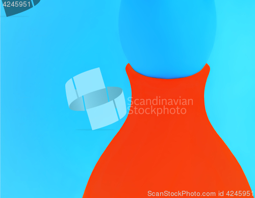 Image of Orange Vase On A Blue Background