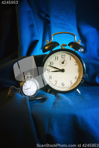 Image of Antique Watch And Alarm Clock