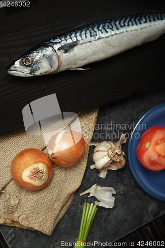 Image of Mackerel and vegetables on a wooden table