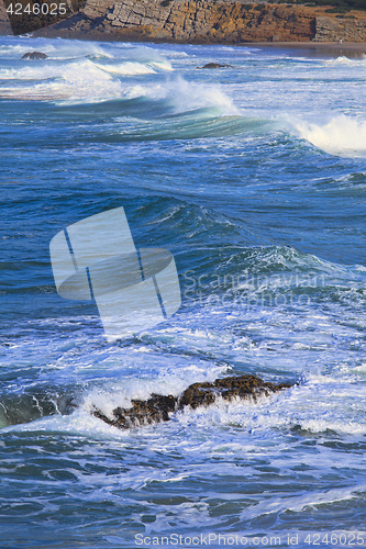 Image of Rocky Coast Extending into the Sea