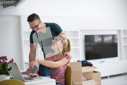 Image of Young couple moving in a new home