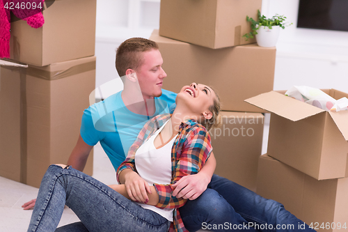 Image of young couple moving  in new house