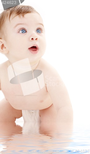 Image of portrait of crawling baby boy looking up