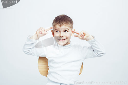 Image of little cute adorable boy posing gesturing cheerful on white background, lifestyle people concept