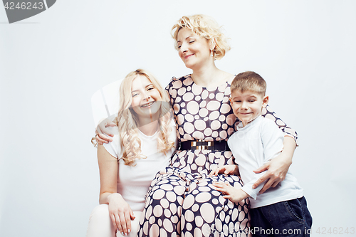 Image of happy smiling family together posing cheerful on white background, lifestyle people concept, mother with son and teenage daughter isolated closeup