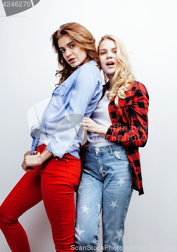 Image of two pretty blond woman having fun together on white background, mature mother and young teenage daughter, lifestyle people concept