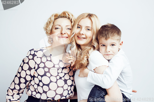 Image of happy smiling family together posing cheerful on white background, lifestyle people concept, mother with son and teenage daughter isolated