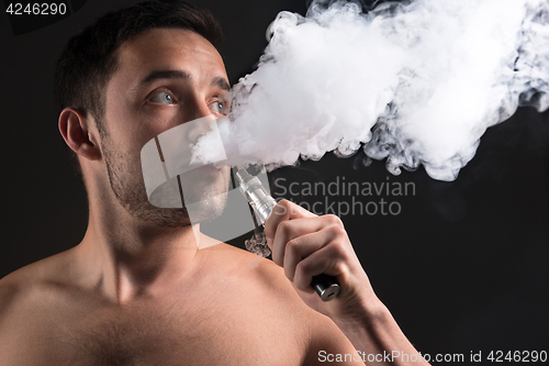 Image of The face of vaping young man