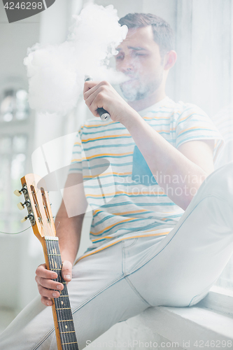 Image of The face of vaping young man