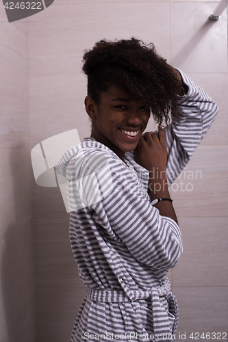 Image of beautiful black woman wearing  bathrobe