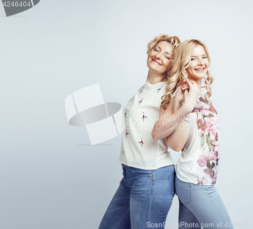 Image of mother with daughter together posing happy smiling isolated on white background with copyspace, lifestyle people concept closeup