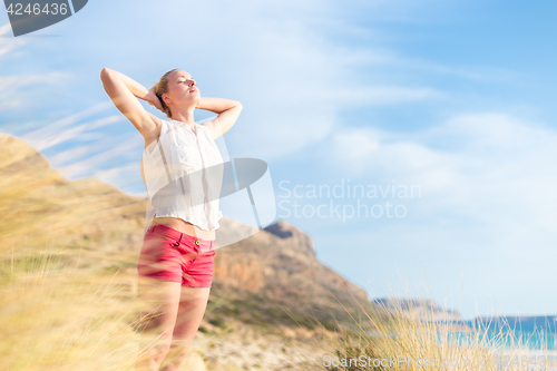 Image of Free Happy Woman Enjoying Sun on Vacations.