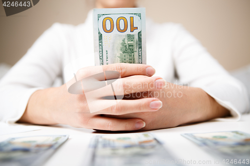 Image of Woman hands holding money