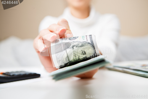 Image of Hands counting money, close up